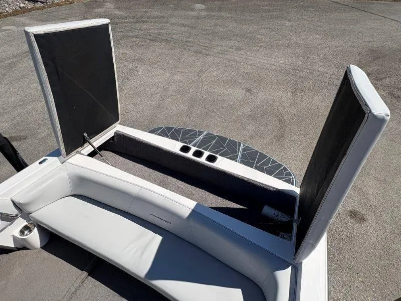 Slide: The Image of 2009 Moomba Outback SK boat interior with open storage compartments and seating. - 21