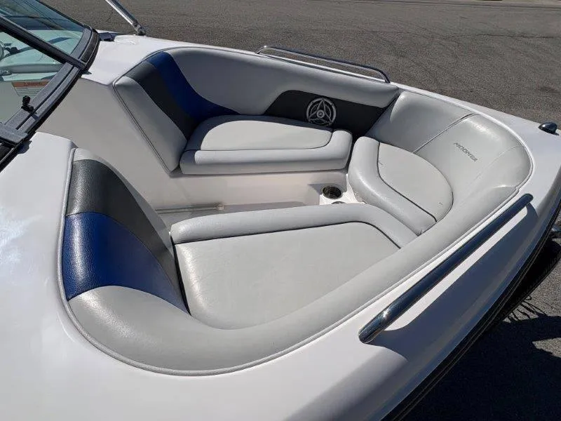 Slide: The Image of 2009 Moomba Outback SK boat interior with gray and blue seating. - 28