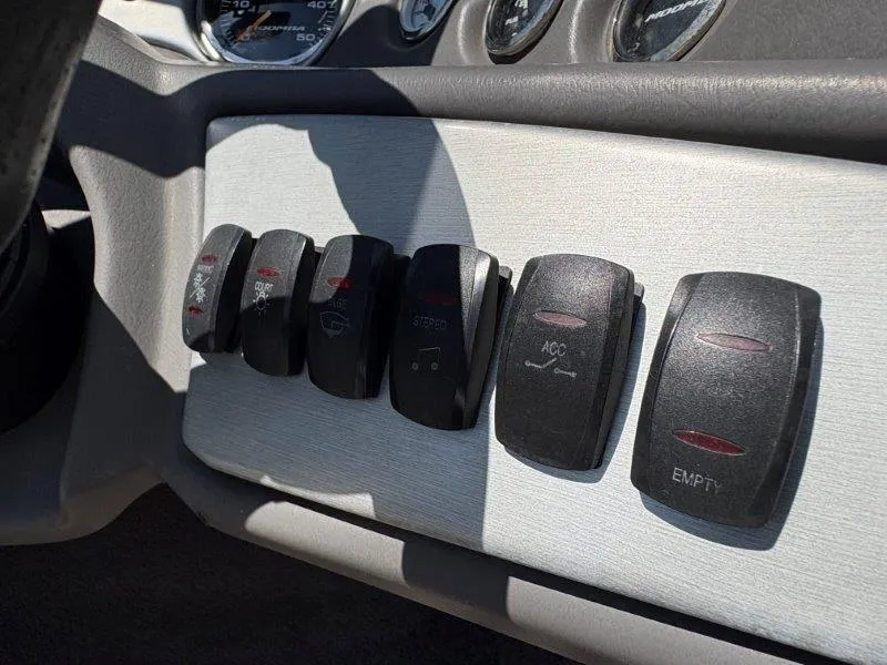 Slide: The Image of Dashboard switches of a 2009 Moomba Outback SK boat. - 30