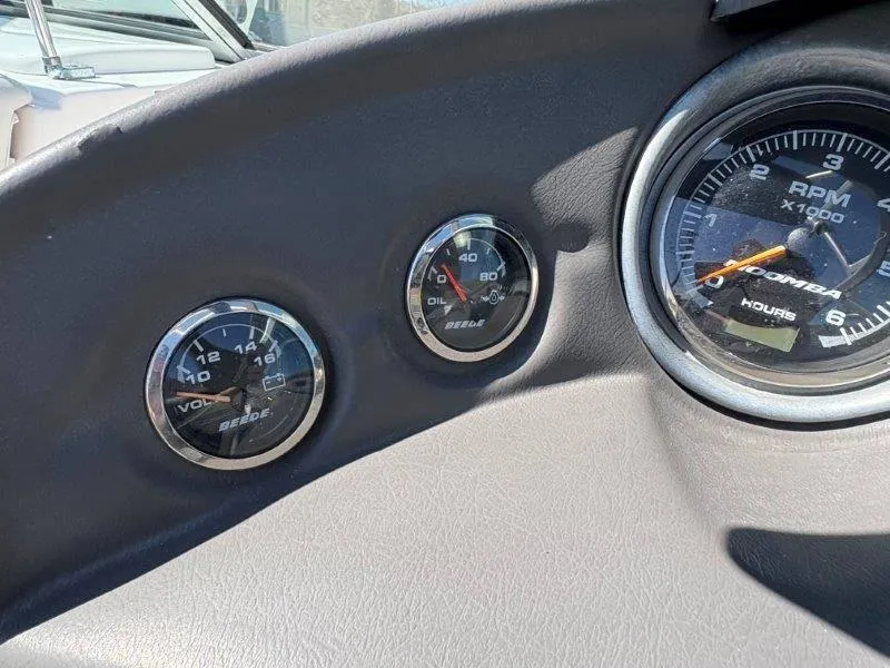 Slide: The Image of Dashboard gauges of a 2009 Moomba Outback SK boat, showing RPM, voltage, and oil pressure. - 33