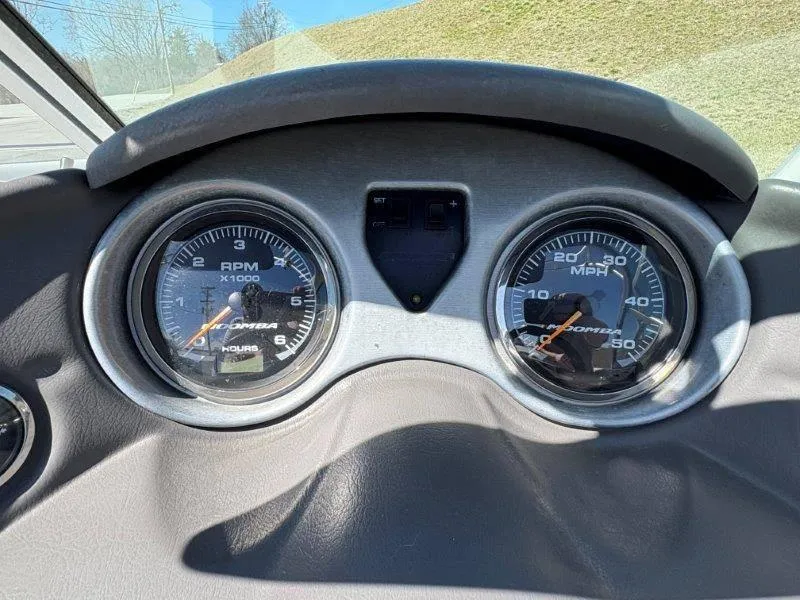 Slide: The Image of Dashboard of a 2009 Moomba Outback SK showing RPM and speed gauges. - 42