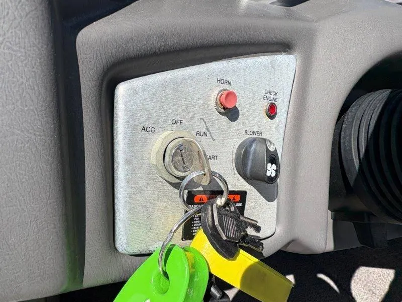 Slide: The Image of 2009 Moomba Outback SK ignition panel with keys, horn, and blower controls. - 44