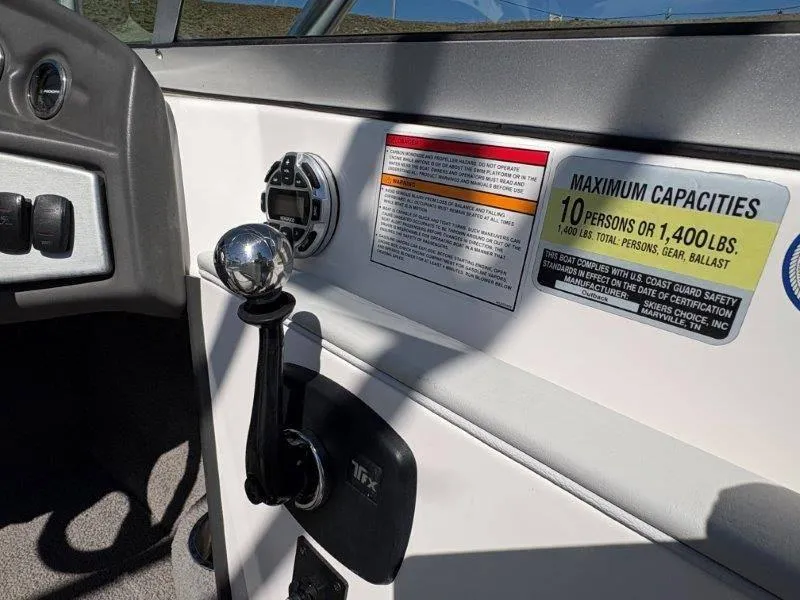 Slide: The Image of 2009 Moomba Outback SK boat interior with capacity label and control panel. - 46