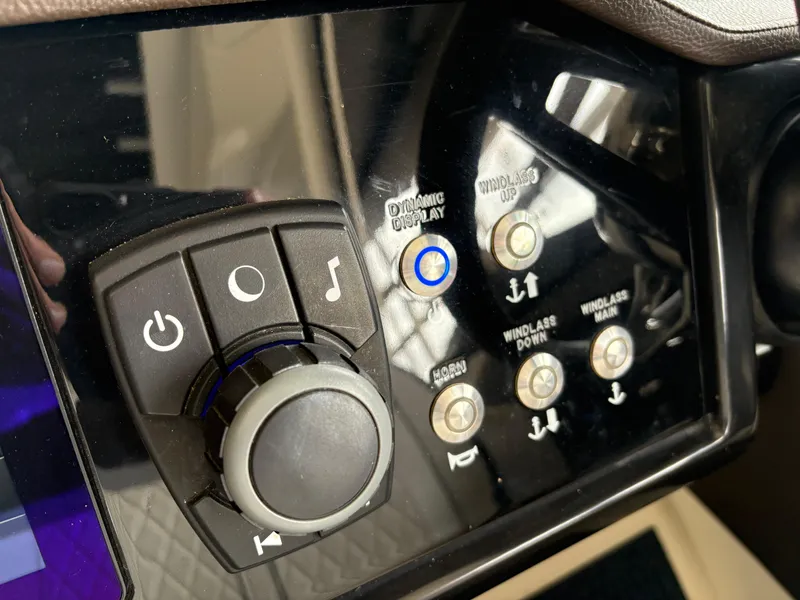 Slide: The Image of Control panel of 2017 Sea Ray SLX 310 boat with various buttons and knobs. - 10