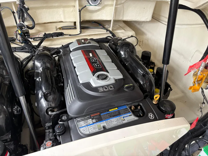 Slide: The Image of 2017 Sea Ray SLX 310 engine compartment with Mercury 6.2L V8 engine. - 14