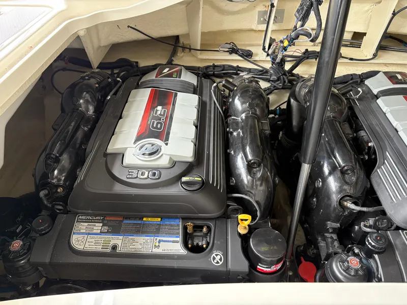 Slide: The Image of Engine compartment of a 2017 Sea Ray SLX 310 boat, featuring a powerful 300 horsepower engine. - 15