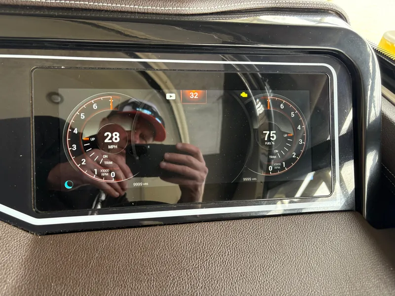 Slide: The Image of Dashboard of 2017 Sea Ray SLX 310 boat showing speed and RPM gauges. - 18