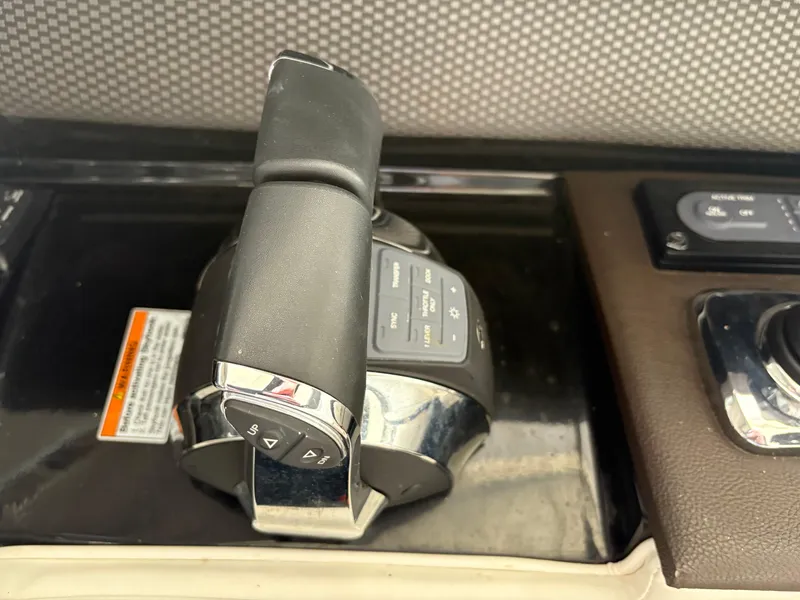 Slide: The Image of Close-up of 2017 Sea Ray SLX 310 boat throttle control. - 20