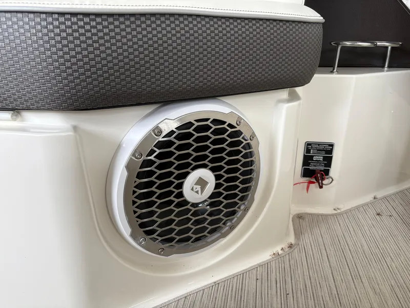 Slide: The Image of 2017 Sea Ray SLX 310 boat speaker and seating detail, showcasing premium marine audio. - 22