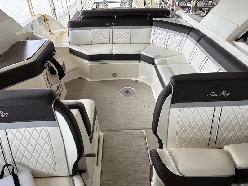 Slide: The Image of 2017 Sea Ray SLX 310 boat interior with luxurious seating and elegant design. - 24