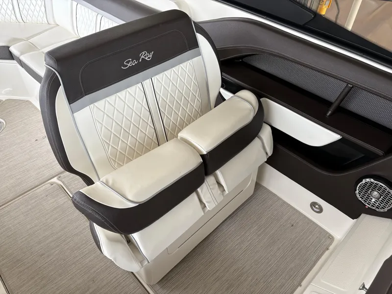 Slide: The Image of 2017 Sea Ray SLX 310 boat seat with quilted upholstery and armrests. - 25