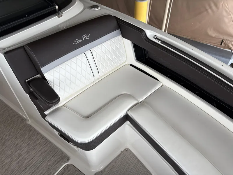 Slide: The Image of 2017 Sea Ray SLX 310 boat interior with white and black seating. - 7