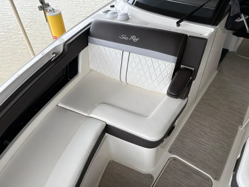 Slide: The Image of 2017 Sea Ray SLX 310 boat interior with white and black seating. - 8