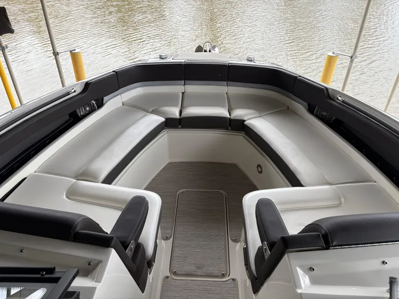 Slide: The Image of 2017 Sea Ray SLX 310 boat interior with spacious seating and elegant design. - 9