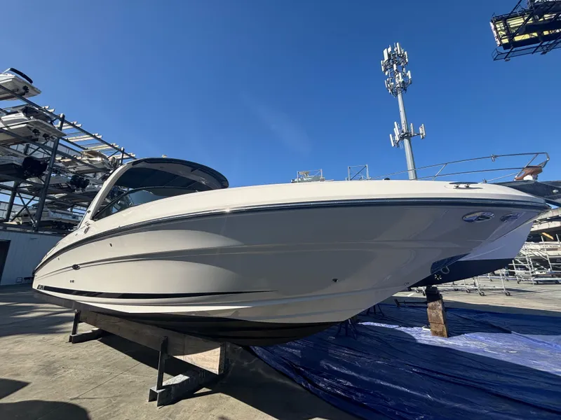 The Image of 2014 Sea Ray 300 SLX boat on display under clear blue sky. - 0