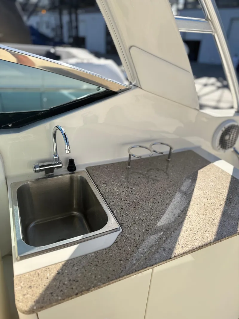 Slide: The Image of 2014 Sea Ray 300 SLX boat kitchenette with sink and countertop. - 10