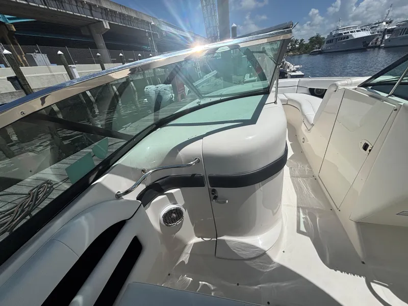 Slide: The Image of 2014 Sea Ray 300 SLX boat interior with sleek design and waterfront view. - 15