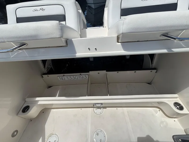 Slide: The Image of 2014 Sea Ray 300 SLX boat interior with seating and storage compartments. - 6