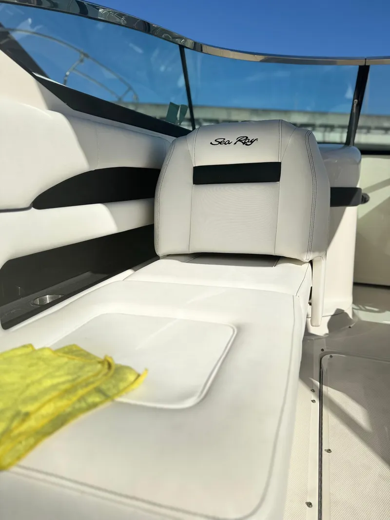 Slide: The Image of 2014 Sea Ray 300 SLX boat interior with white seating and sleek design. - 8