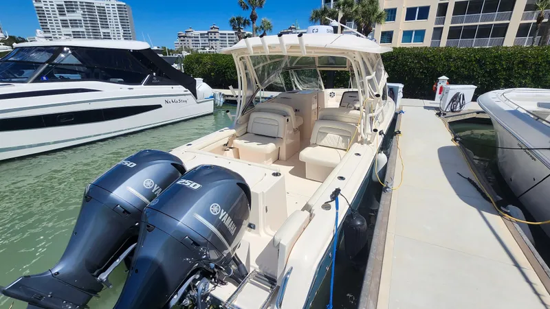 Slide: The Image of 2020 Grady-White Freedom 285 boat docked with twin Yamaha engines. - 2