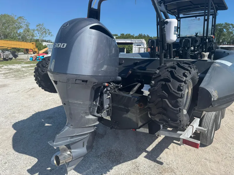 Slide: The Image of 2020 Sea Legs Hydrasol Amphibious RIB 30 with outboard motor and rugged tires on a trailer. - 17