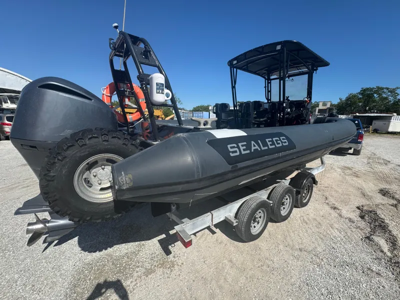 Slide: The Image of Amphibious RIB boat on trailer, 2020 Sea Legs Hydrasol model, parked outdoors. - 18