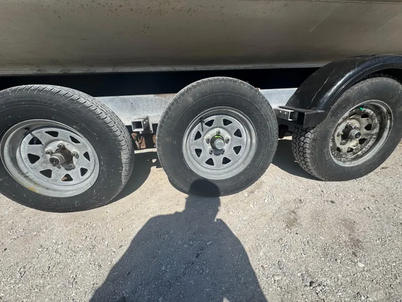 Slide: The Image of Three wheels of a 2020 Sea Legs Hydrasol Amphibious RIB 30 on gravel. - 20