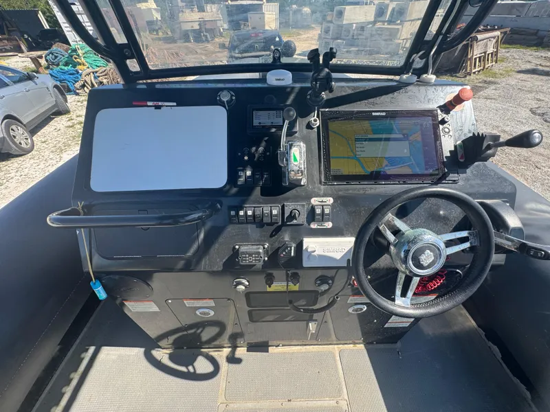 Slide: The Image of Cockpit of 2020 Sea Legs Hydrasol Amphibious RIB 30 with navigation equipment and steering wheel. - 26