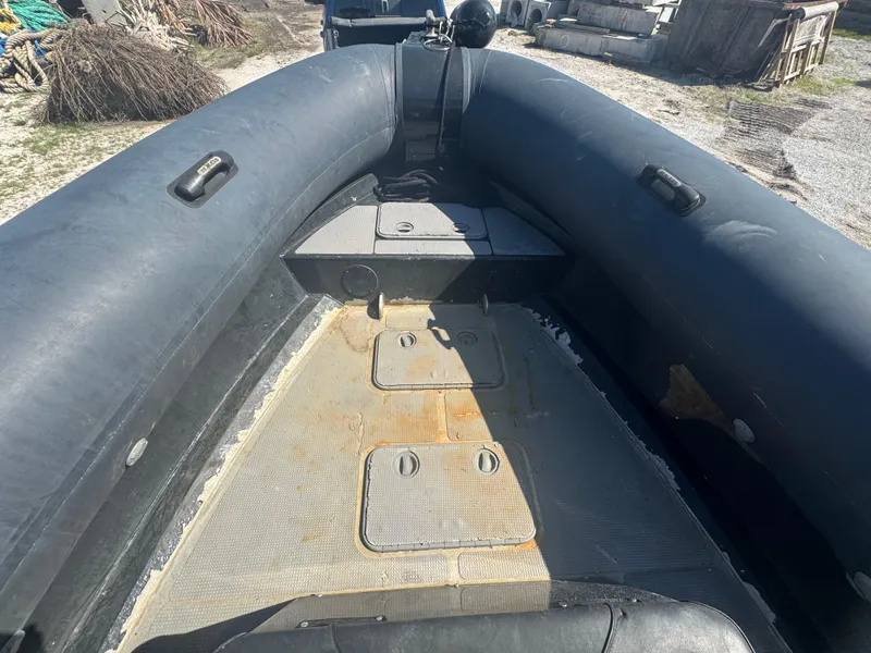 Slide: The Image of Amphibious RIB boat interior, Custom Sea Legs Hydrasol, 2020 model, showing seating and storage. - 31