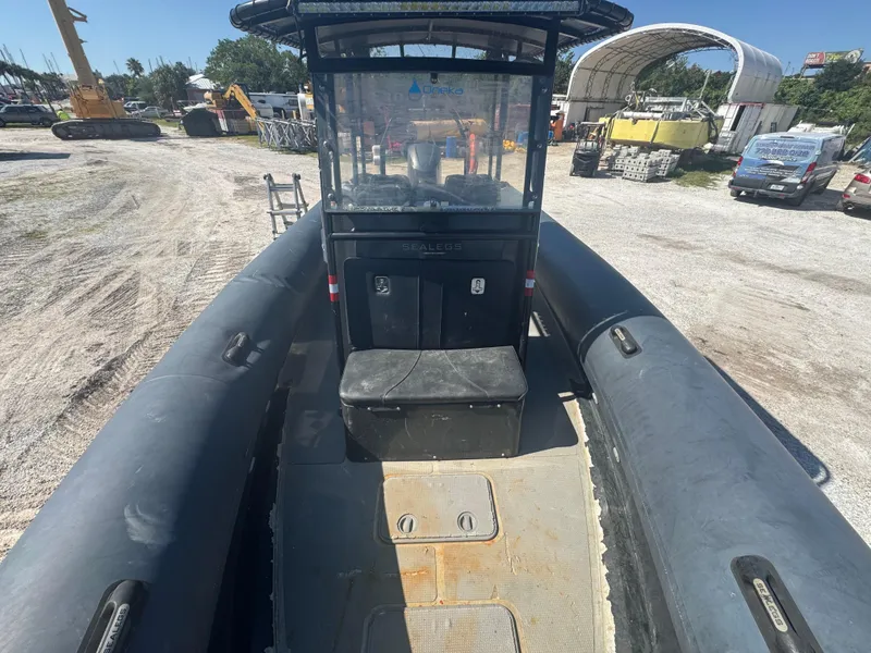 Slide: The Image of 2020 Custom Sea Legs Hydrasol Amphibious RIB 30, interior view, parked on gravel. - 34