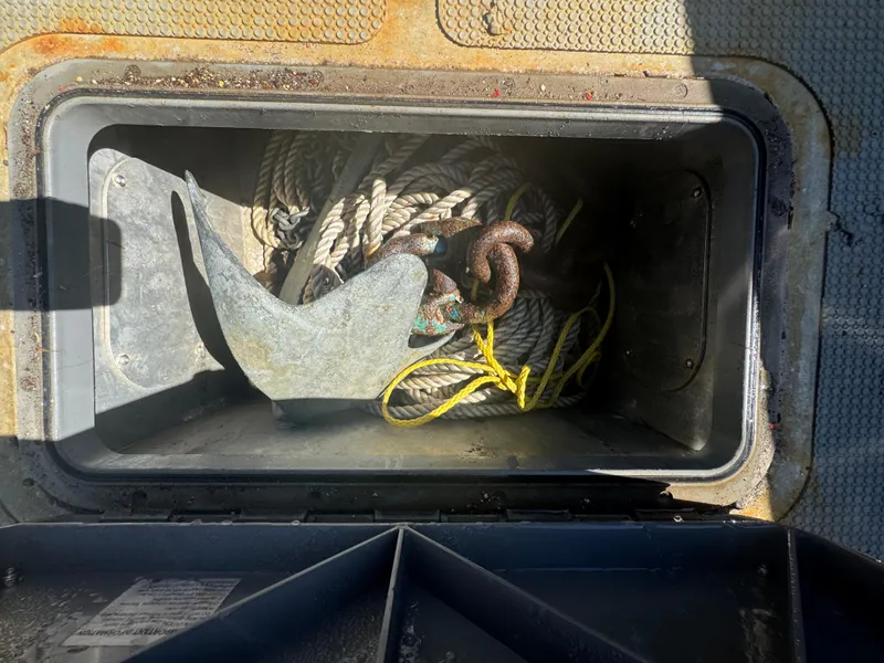 Slide: The Image of Anchor and ropes stored in a compartment of a 2020 Sea Legs Hydrasol Amphibious RIB 30. - 37