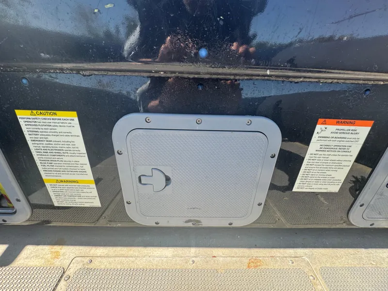 Slide: The Image of Access panel on 2020 Sea Legs Hydrasol Amphibious RIB 30 with caution and warning labels. - 44