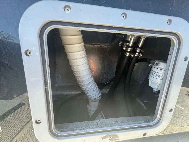 Slide: The Image of Inspection hatch of 2020 Sea Legs Hydrasol Amphibious RIB 30 showing internal hoses and fittings. - 45