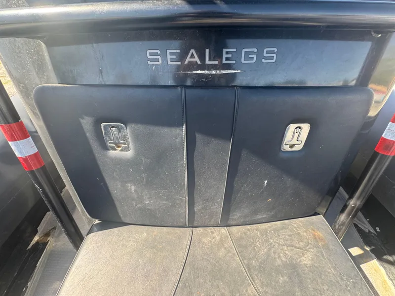 Slide: The Image of Interior of 2020 Sea Legs Hydrasol Amphibious RIB 30, featuring black seating and logo. - 47