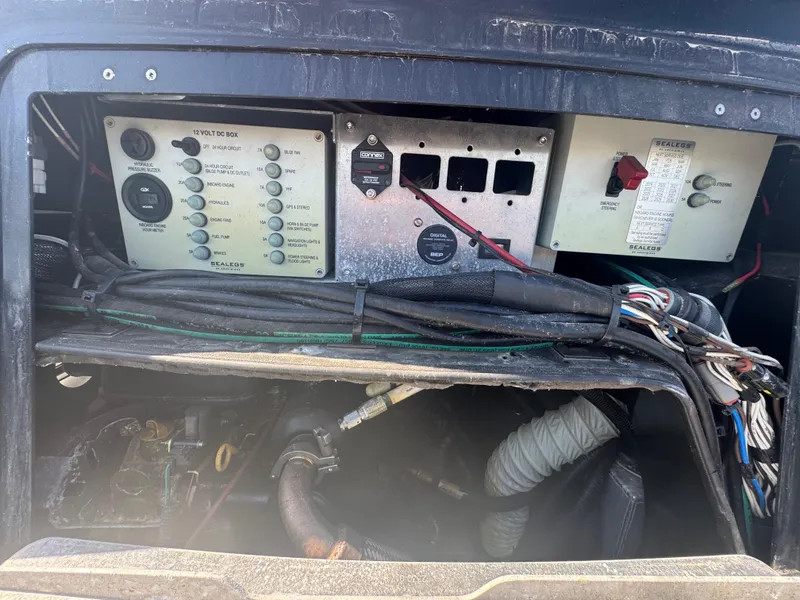 Slide: The Image of Control panel of a 2020 Sea Legs Hydrasol Amphibious RIB 30 with wiring and components. - 48