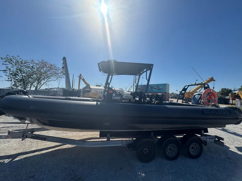 Slide: The Image of 2020 Sea Legs Hydrasol Amphibious RIB 30 on trailer under bright sun. - 7