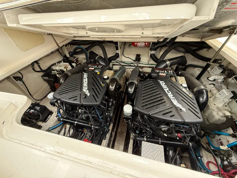 Slide: The Image of Engine compartment of 2005 Sea Ray 340 Sundancer with twin Mercury engines. - 27