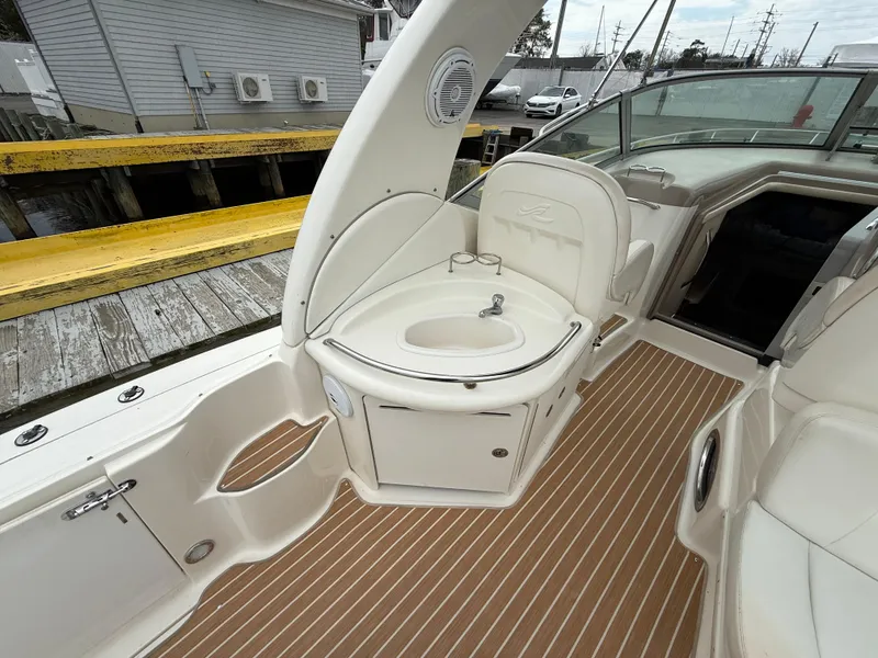 Slide: The Image of 2005 Sea Ray 340 Sundancer boat interior with sink and seating area. - 33