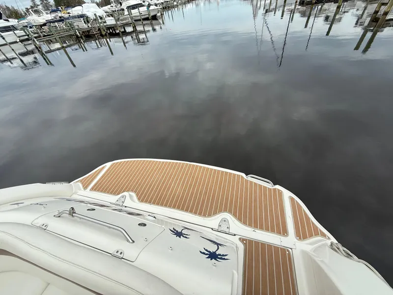 Slide: The Image of 2005 Sea Ray 340 Sundancer boat deck with marina view. - 36