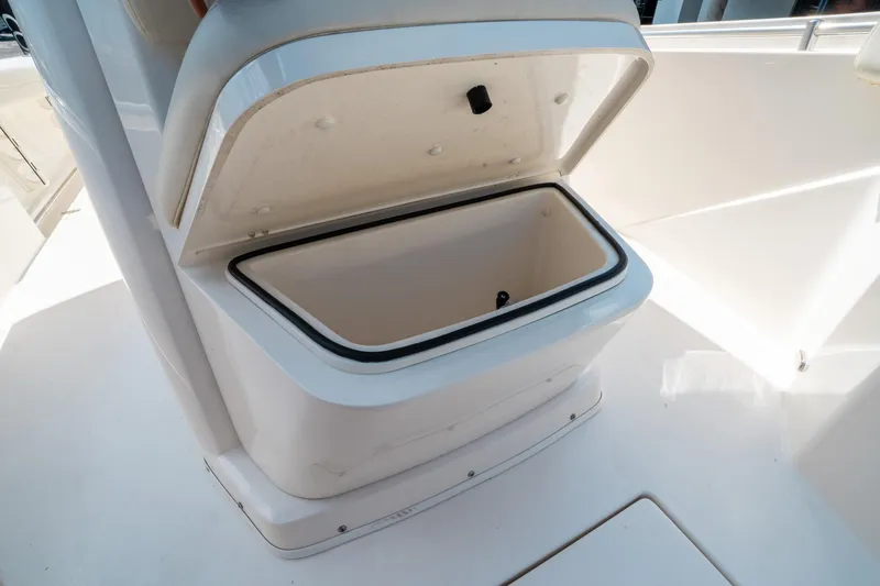 Slide: The Image of Open storage compartment on 2023 Cobia 240 CC boat. - 36