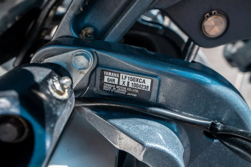 Slide: The Image of Close-up of Yamaha LF150XCA engine on 2023 Cobia 240 CC boat. - 38