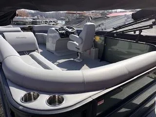 Slide: The Image of 2025 Bentley Pontoons 220 Cruise XL interior with plush seating and modern helm. - 4