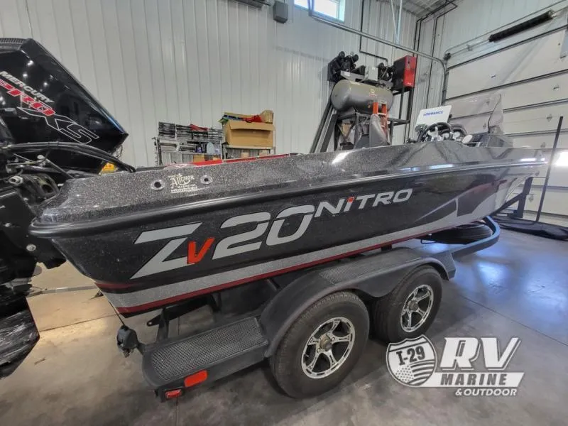 Slide: The Image of 2022 Nitro ZV20 boat on trailer in indoor garage setting. - 1