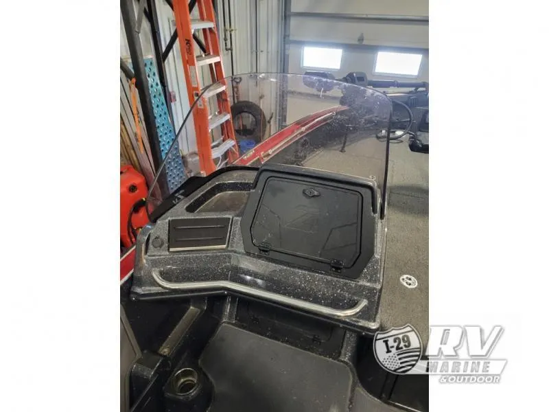 Slide: The Image of 2022 Nitro ZV20 boat console with windshield in a garage setting. - 10