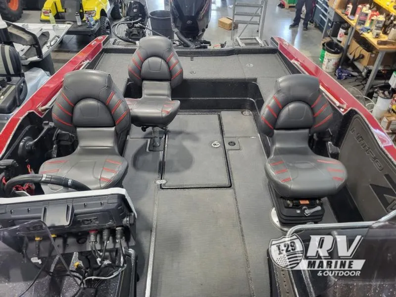 Slide: The Image of 2022 Nitro ZV20 boat interior with three seats and control panel in a showroom. - 14