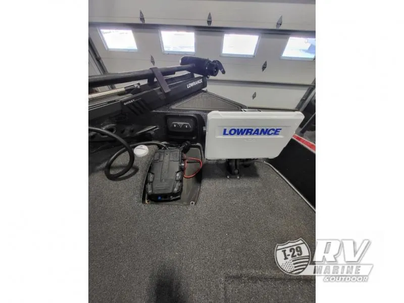 Slide: The Image of 2022 Nitro ZV20 boat with Lowrance electronics and trolling motor in a garage. - 7