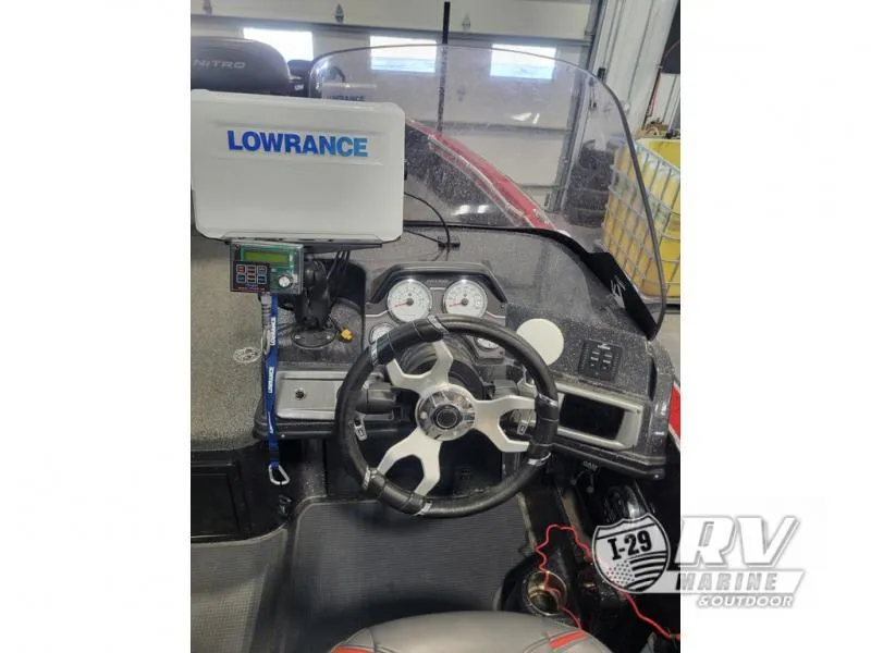 Slide: The Image of 2022 Nitro ZV20 boat dashboard with Lowrance system and steering wheel. - 9