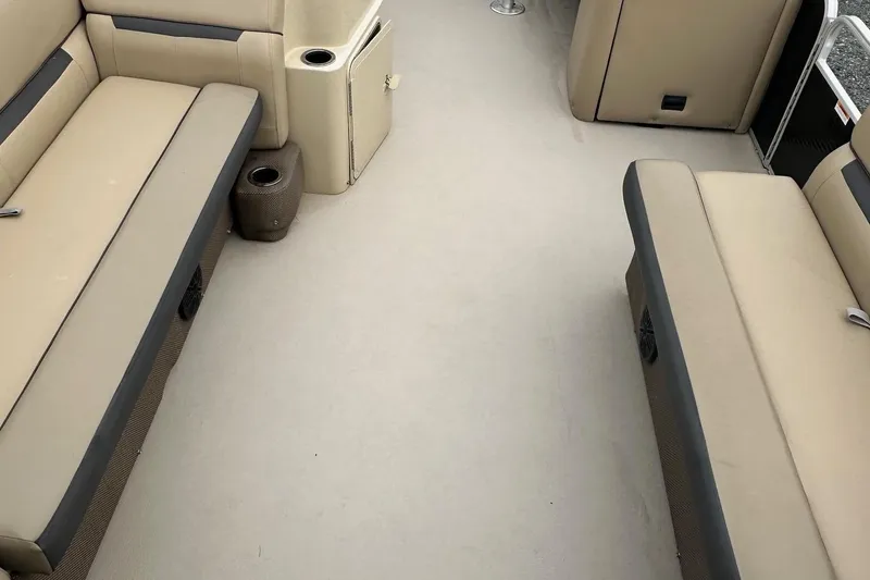 Slide: The Image of Interior of a 2019 Godfrey Sweetwater 2086C pontoon boat with beige seating. - 10