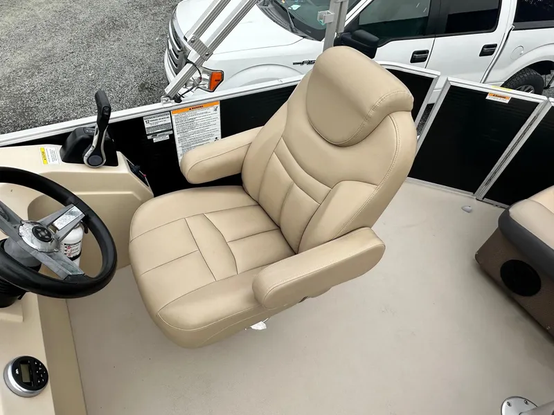 Slide: The Image of 2019 Godfrey Sweetwater 2086C boat captain's chair, beige upholstery, steering wheel visible. - 4