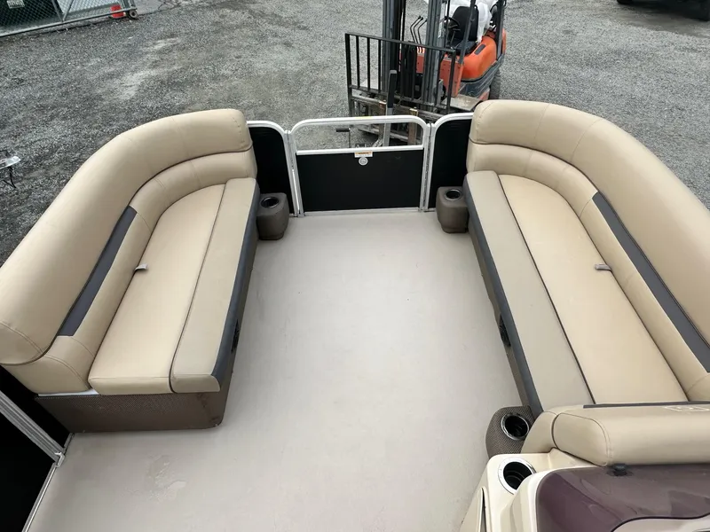 Slide: The Image of 2019 Godfrey Sweetwater 2086C pontoon boat interior with beige seating and spacious layout. - 6